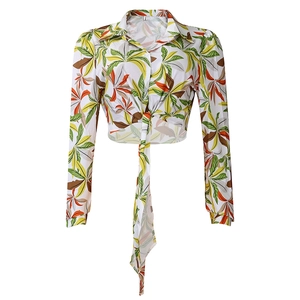 Detail of tropical palm leaf print short shirt with front tie-up knot and lapel collar