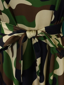 Detailed view of the waist-tie knot and jungle camouflage print on a midi dress
