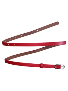 Detailed view of women's red leather waist belt with elegant silver metal buckle