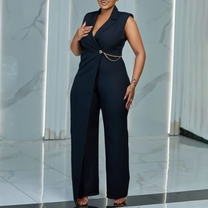 Detail of navy sleeveless jumpsuit with V-neckline and decorative gold waist chain