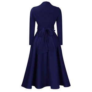 Rear view of deep blue long sleeve midi dress with large bow tie waist and pleated A-line skirt