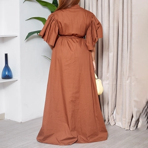 Rear view of caramel maxi dress featuring pleated flare sleeves and cinched waist belt