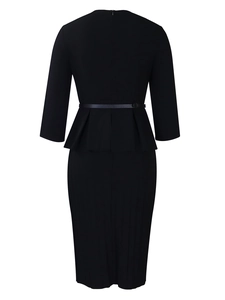Detail of black V-neck dress featuring a peplum waist, slim belt, and back zipper