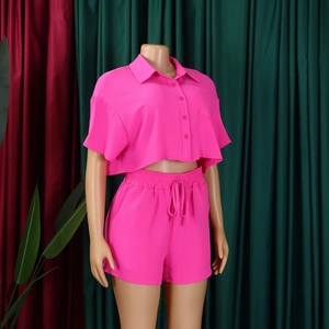 Detail of rose red short-sleeved lapel shirt and drawstring shorts two-piece set