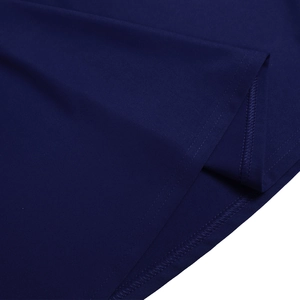 Detailed close-up of double-needle stitching and hem on navy blue knitted fabric garment