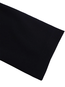 Close-up of high-quality black woven fabric detail showing smooth texture and fiber weave