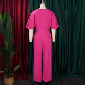 Detail showing the elegant backless design and wide-leg cut of this rose red jumpsuit