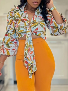 Women's 2-piece set featuring a tropical print tie-front shirt and orange high-waist pants