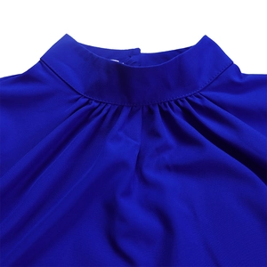 Close-up of royal blue puff sleeve top featuring a high neck with pleated texture details