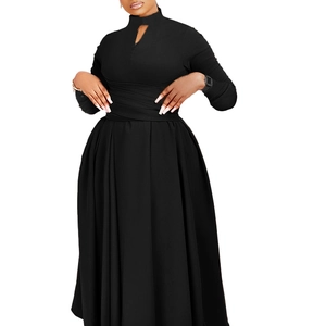 Detail view of the black pleated dress featuring a high neckline and elegant waist drape