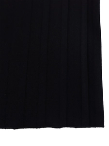 Detailed macro view of black pleated fabric texture with neat overlock stitching hemline
