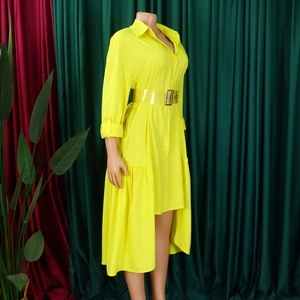 Detail view of bright yellow shirt dress with irregular hem and transparent belt with buckle