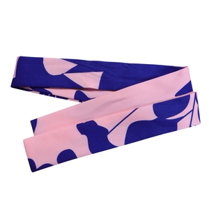 Detail of pink and blue abstract print fabric necktie with a smooth satin-like texture
