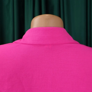 Close-up of the collar structure and fabric texture on a magenta summer shirt jacket