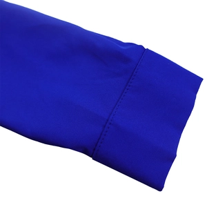Detail view of royal blue fabric sleeve cuff with high-density fine stitching and smooth finish