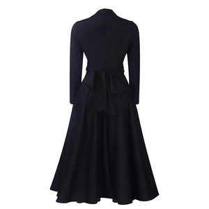 Detail of elegant black long sleeve maxi dress with back zipper and large waist bow