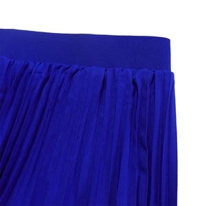 Detail of royal blue pleated skirt showing vertical pleats and elastic waistband