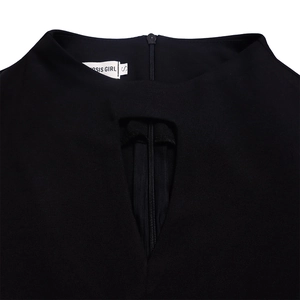 Detail of elegant black neckline with geometric cutout and zipper on a flared dress