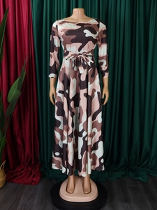 Detail of A-line camouflage dress with waist tie and round neck in long length