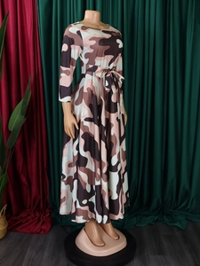 Detail of printed maxi dress featuring a waist tie and abstract camou-style pattern