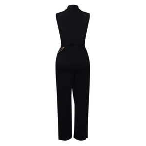 Detail of elegant black sleeveless jumpsuit with golden waist chain and back zipper closure