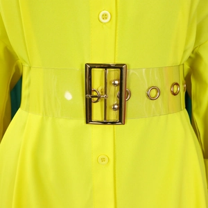Detail of neon yellow shirt dress with transparent PVC belt and gold buckle accent
