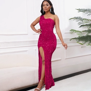 Detail of fuchsia sequin evening dress featuring a sexy one-shoulder cut and high side slit