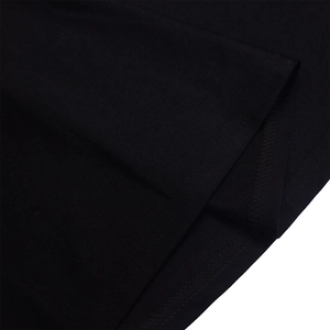 Detailed close-up showing the high-quality double-needle hem stitching on black fabric