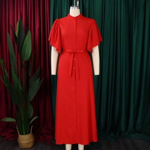 Detail of red tiered flare sleeves and button-down front on a long summer dress