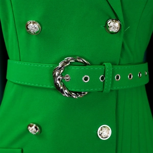 Detailed view of green blazer dress waist with golden embossed buttons and a matching belt