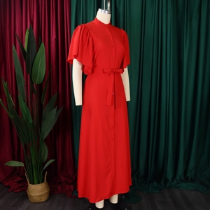 Detail view of red retro flare sleeve maxi dress with button-down collar and waist belt