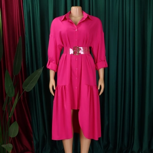 Detail of rose pink shirt dress featuring irregular ruffled hem and transparent PVC belt