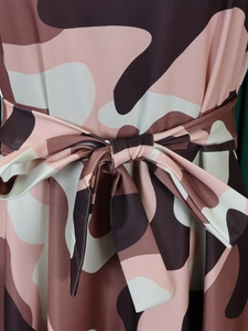 Close-up of pink camouflage pattern fabric and adjustable waist tie on a midi dress