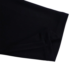 Close-up of the professional hem stitching and breathable black knit fabric texture