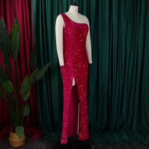 Detail of fuchsia one-shoulder sequin evening dress with side slit and shiny finish