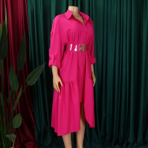 Detail of fuchsia shirt dress with layered irregular hem and transparent belt on mannequin