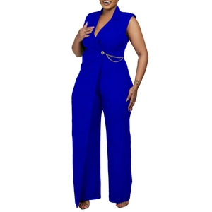 Detail of elegant royal blue sleeveless jumpsuit featuring a lapel collar and gold chain belt