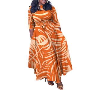 Detail of plus size maxi dress featuring tropical orange palm leaf print and belted waistline