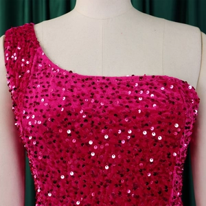 Detail of rose red one-shoulder sequin dress with high-density shimmering circular sequins