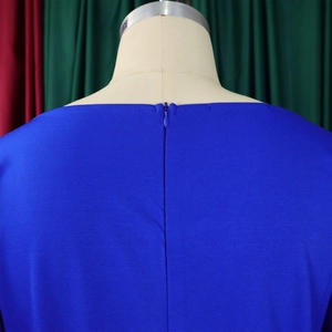 Close-up of the back invisible zipper closure on blue high waist wide leg jumpsuit