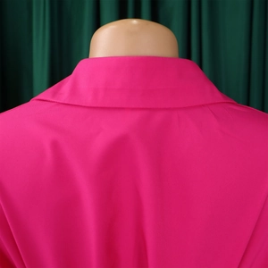 Close-up of rose pink lapel collar and shoulder seam details on casual shirt dress