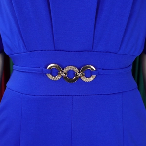 Close-up of royal blue ribbed knit fabric with gold triple ring rhinestone waist buckle