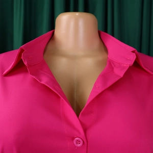 Detail of magenta lapel collar and buttons on a casual loose-fit shirt dress