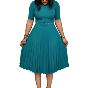Detail showing the pleated skirt and matching buckled waist belt of a teal midi dress