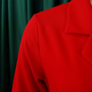 Close-up of red blazer dress shoulder and lapel with premium textured fabric detail