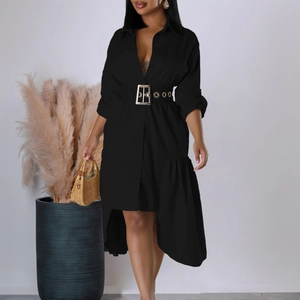 Detail of black high-low shirt dress featuring a metallic buckle belt and woven fabric