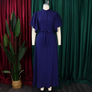 Close-up of deep purple maxi dress featuring button-down front and flared ruffle sleeves