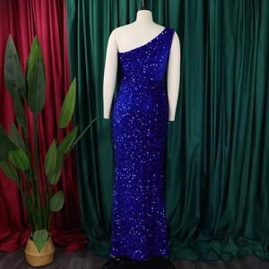 Detailed back view of a royal blue sequin evening gown on a mannequin with shiny texture