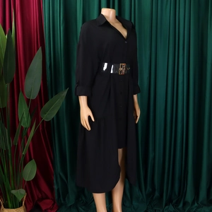 Detail of black shirt dress with sheer PVC belt and asymmetrical high-low hemline