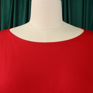 Detail of red round neck jumpsuit with high-quality double stitching on neckline